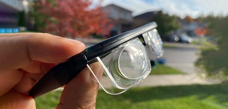 PrimaFocus man holding the glasses in his backyard